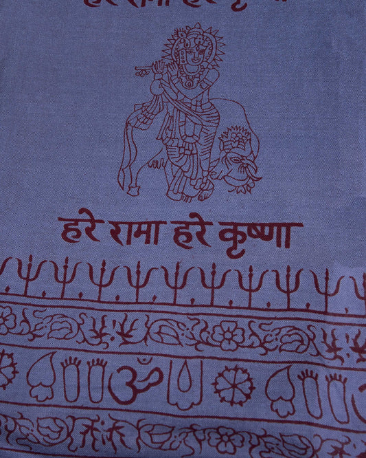 Close-up of blue Krishna mantra design on rayon viscose yoga scarf, ethically made in India.