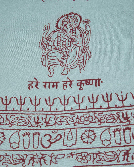 Close-up of turquoise Ganesha motif on Indian yoga scarf, ethical handmade spiritual accessory.