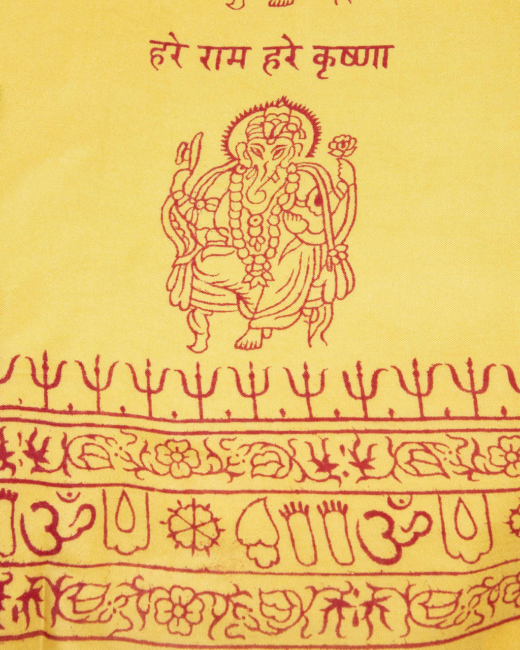 Close-up of yellow Ganesha deity print on Indian yoga scarf, ethically handmade and screen printed.