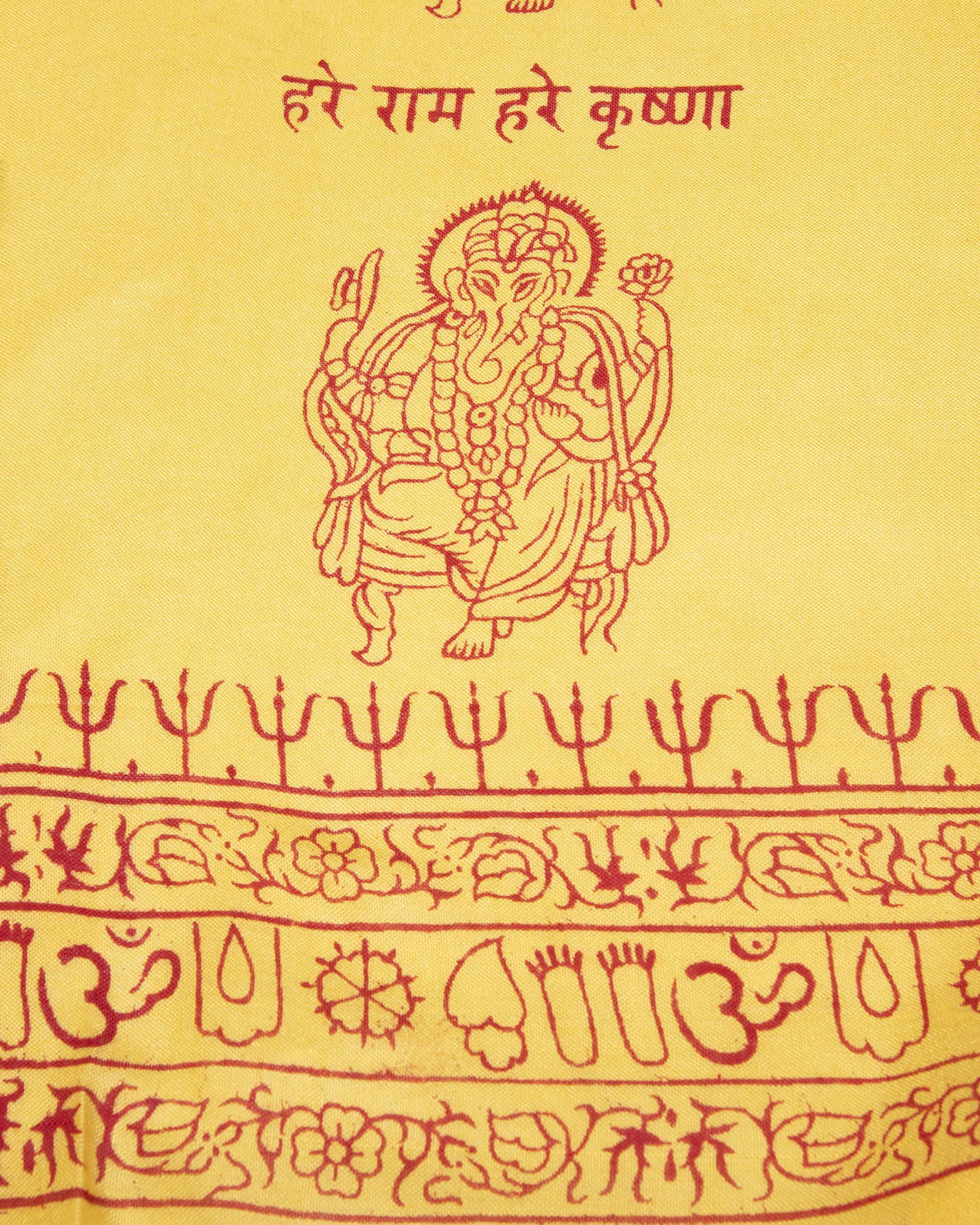 Close-up of yellow Ganesha deity print on Indian yoga scarf, ethically handmade and screen printed.