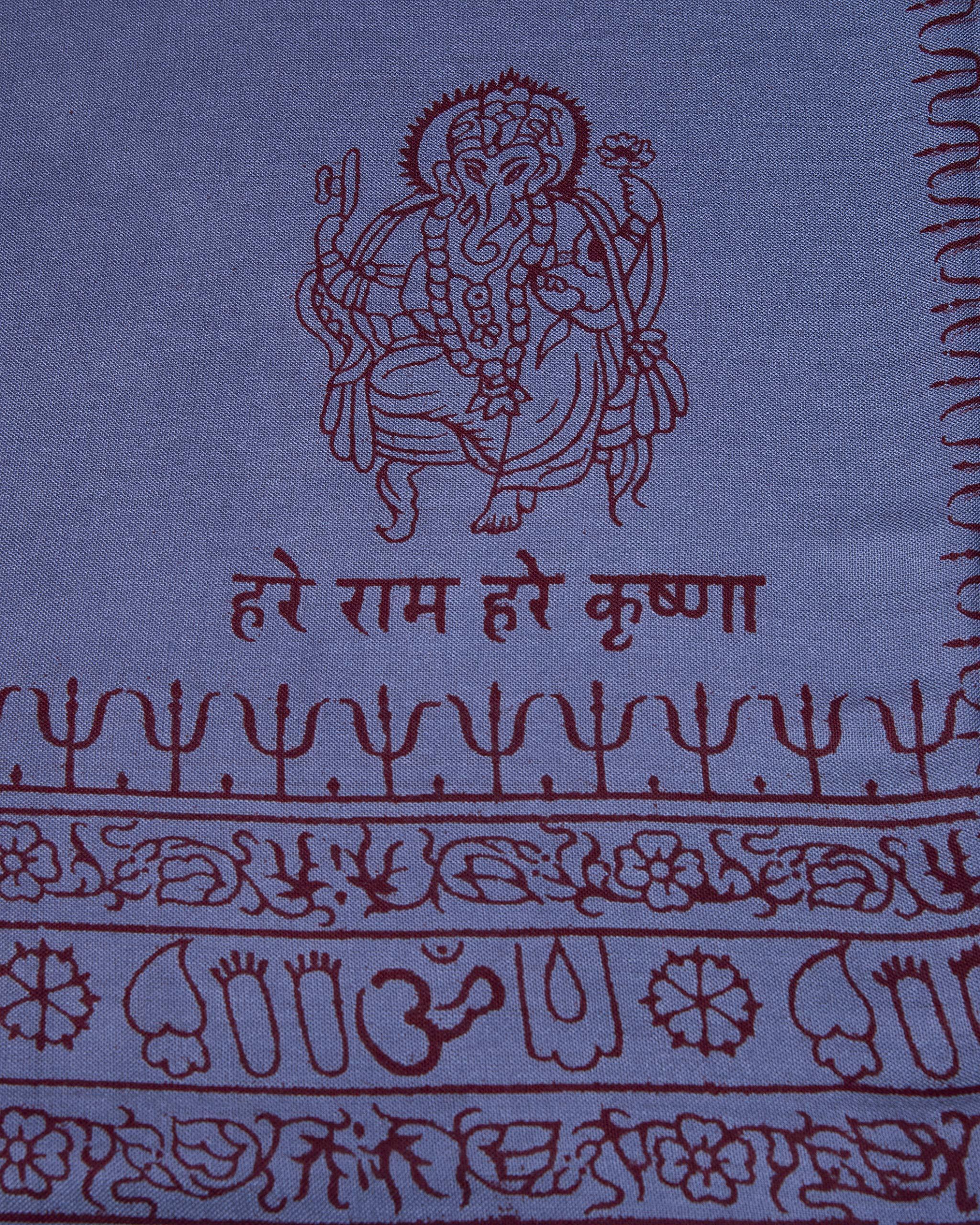 Detail of blue Ganesha print on soft yoga meditation shawl, traditional Indian screen printed design.