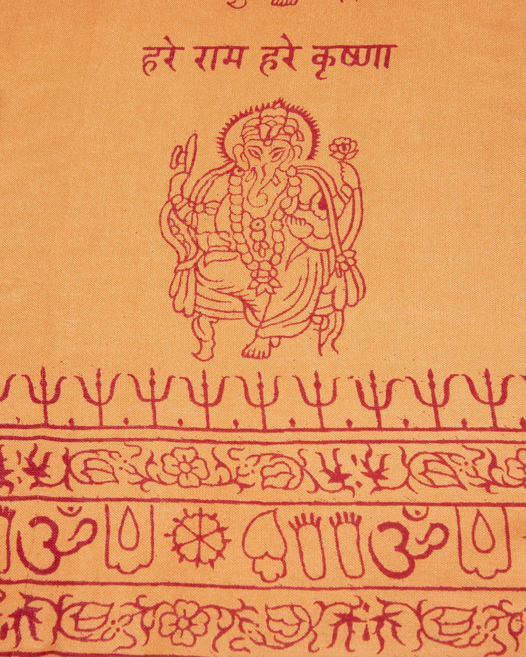 Detail of orange Ganesha yoga shawl, soft rayon viscose spiritual wrap.